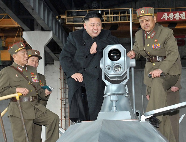 Kim inspects combination death ray and telescope. "Ha ha", he says, "I can see America from here"
