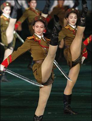 He also inspects a 'Kick out the Imperialists' dance  by his elite all girl death squad and chorus line.