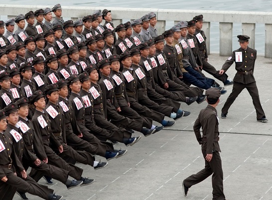 Squad leader points out soldier who wore blue sox on white sock day. "No Soup for You" his comrades sing in unison.