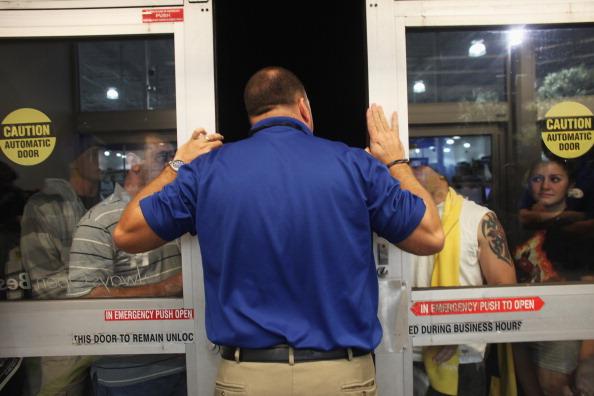 A store manager asks crowds to not knock him down as they gear up for the 'Red Bull fueled rush' to grab anything with a tag that says 'Sale'