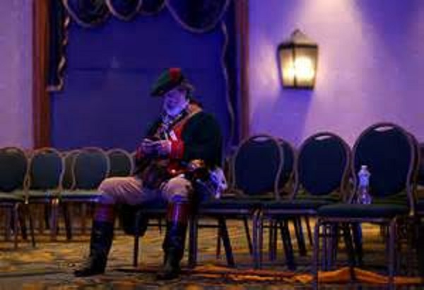 A lone lacky waits for instructions at a Republican leadership conference